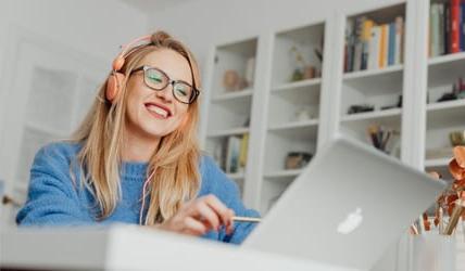 Women on laptop practicing Cyber Security 